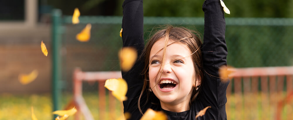 Girl in Autumn Leaves