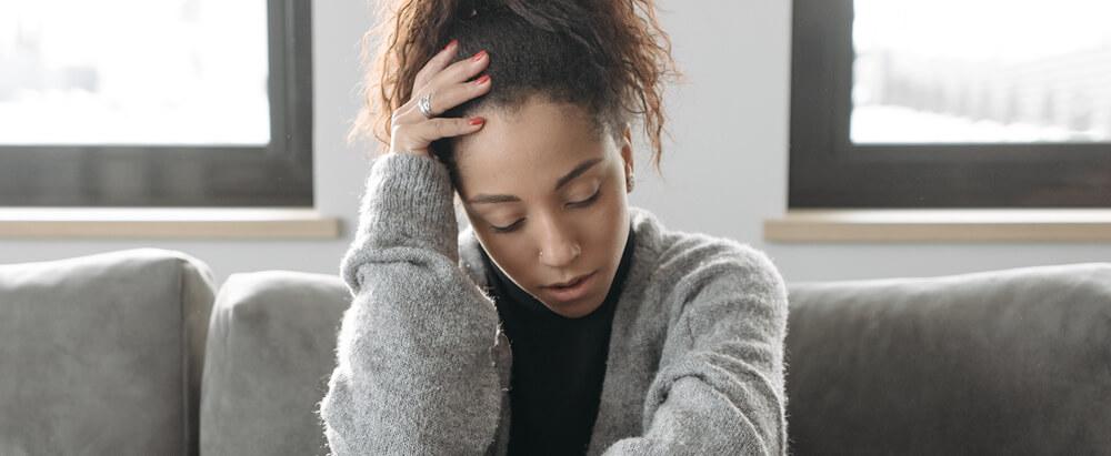 Woman holding her head