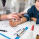 doctor holding a bandage on a child after receiving a shot