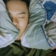 Person sleeping soundly with asthma care support in Arkansas.