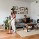 Woman vacuuming to remove dust mites and reduce allergy symptoms