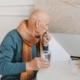 Elderly man in need of an allergy and asthma specialist appointment to treat his chronic cough.
